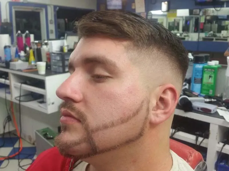 A thin beard line blended into the fade
