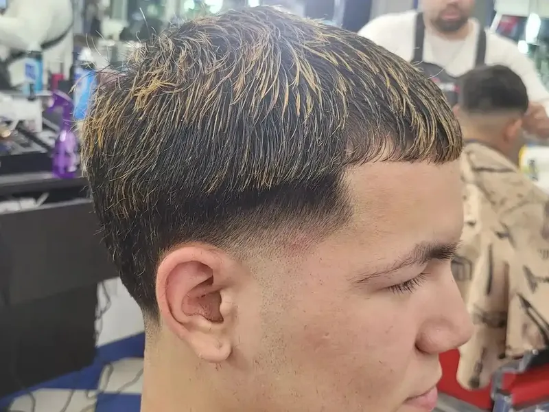 A taper fade with textured top