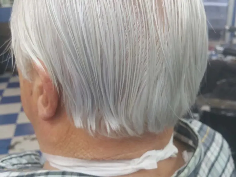 A senior haircut, neck strip on