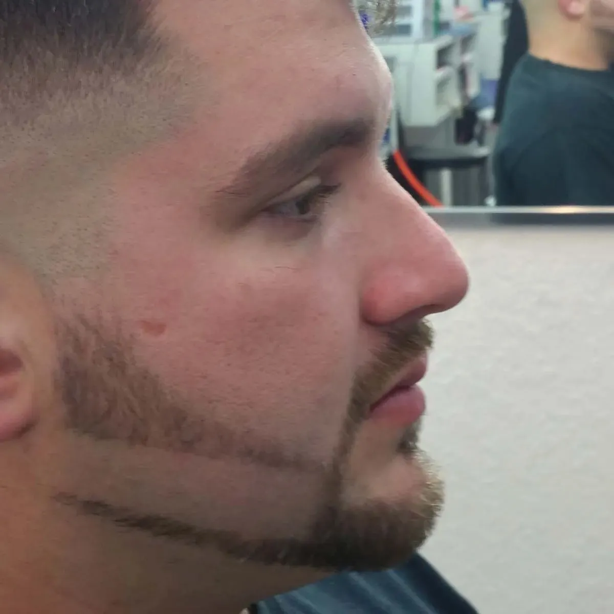 A finished beard line and fade, close up